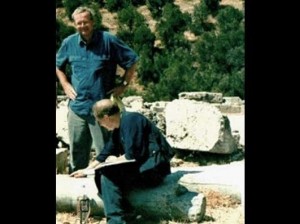 Tony Harrison, important modern poet, with Jim Potts, in Delphi, 2003. Searching for the fading initials on a fallen column, of Lord Byron and Hobhouse - Image Credit: Jim Potts © 2018